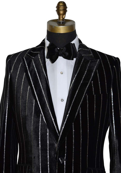 close-up back pinstripe suit on a mannequin with a white shirt and black bow tie.