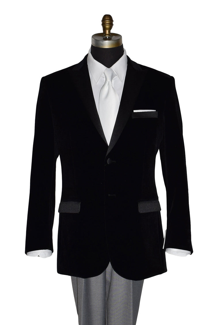 Black velvet tuxedo jacket with white shirt and a white long necktie on a mannequin against a white background