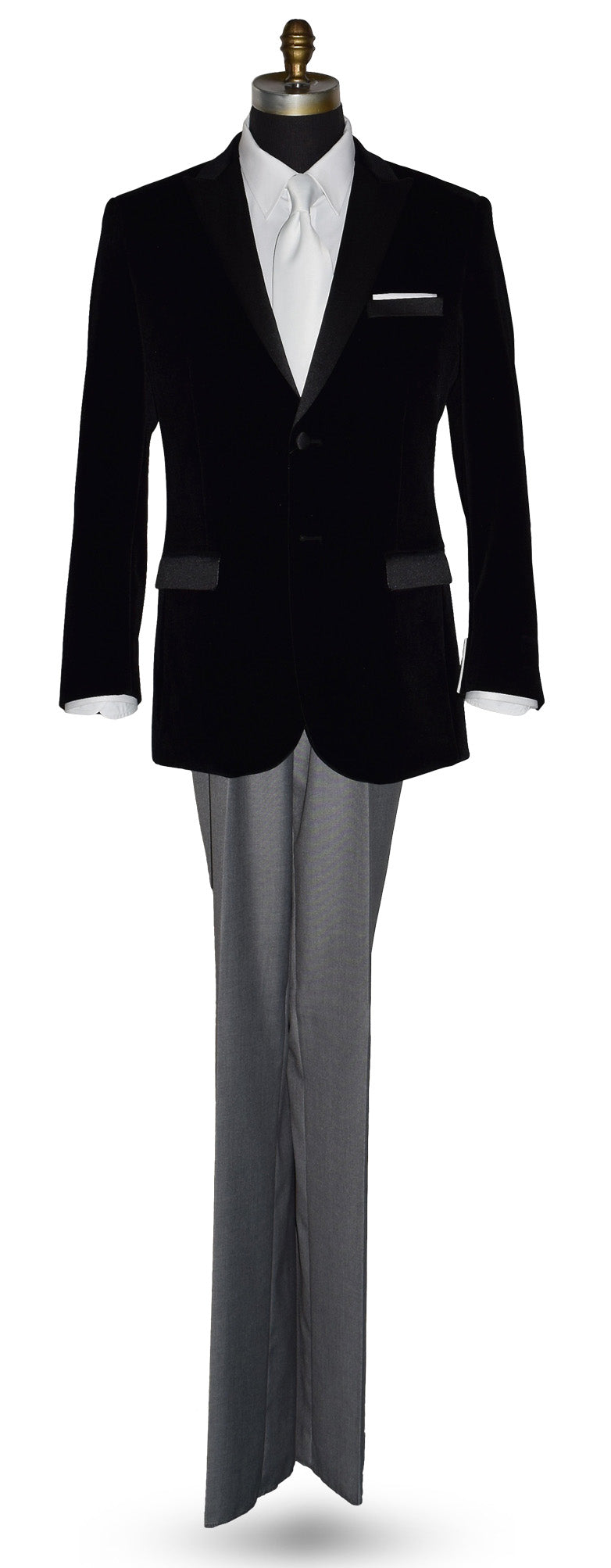 life size mannequin wearing black velvet tuxedo with white shirt and gray pants and a white satin necktie on a mannequin against a white background