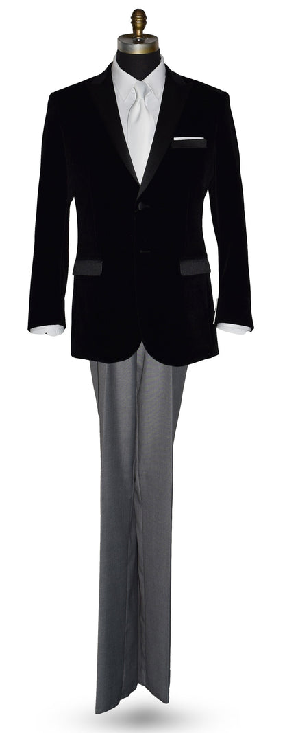 life size mannequin wearing black velvet tuxedo with white shirt and gray pants and a white satin necktie on a mannequin against a white background