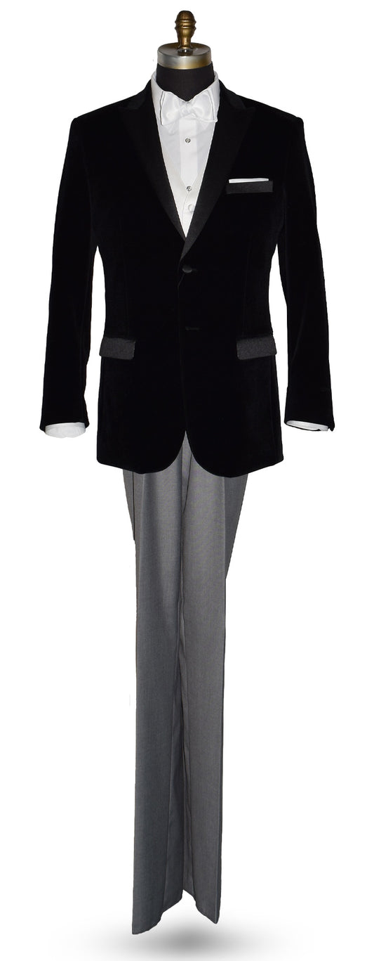 Black velvet tuxedo with white shirt and gray pants and a white satin bowtie on a mannequin against a white background