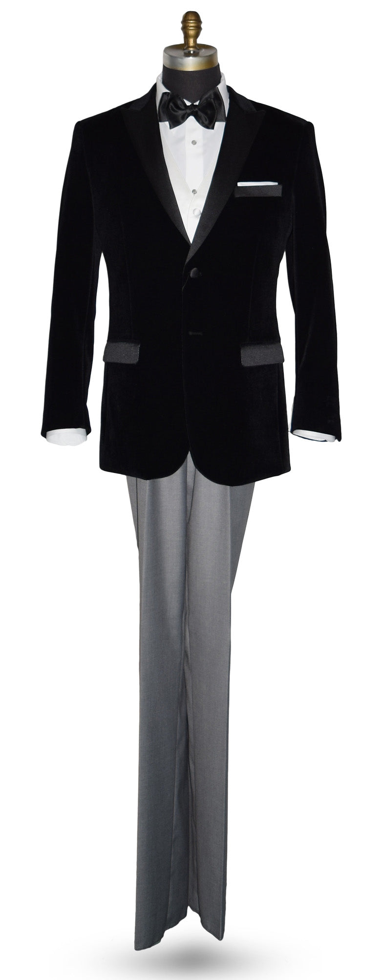 life size mannequin wearing black velvet tuxedo with white shirt and gray pants and a black satin tie-yourself bowtie on a mannequin against a white background