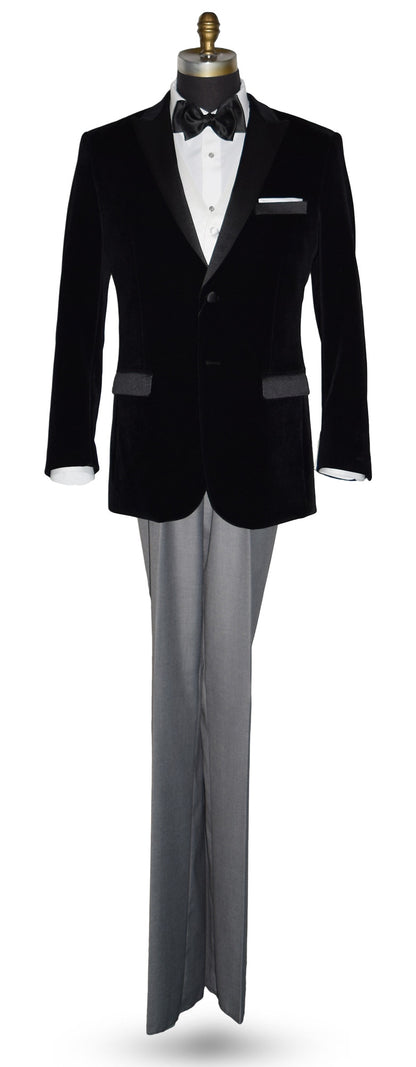 life size mannequin wearing black velvet tuxedo with white shirt and gray pants and a black satin tie-yourself bowtie on a mannequin against a white background