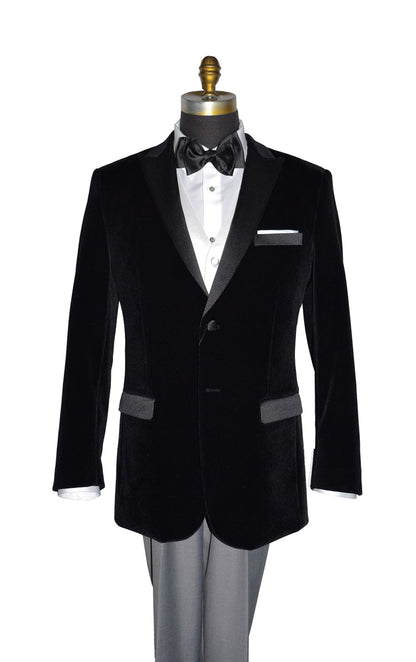 close-up  mannequin wearing black velvet tuxedo with white shirt and gray pants and a black satin tie-yourself bowtie and also a white satin vest on a mannequin against a white background