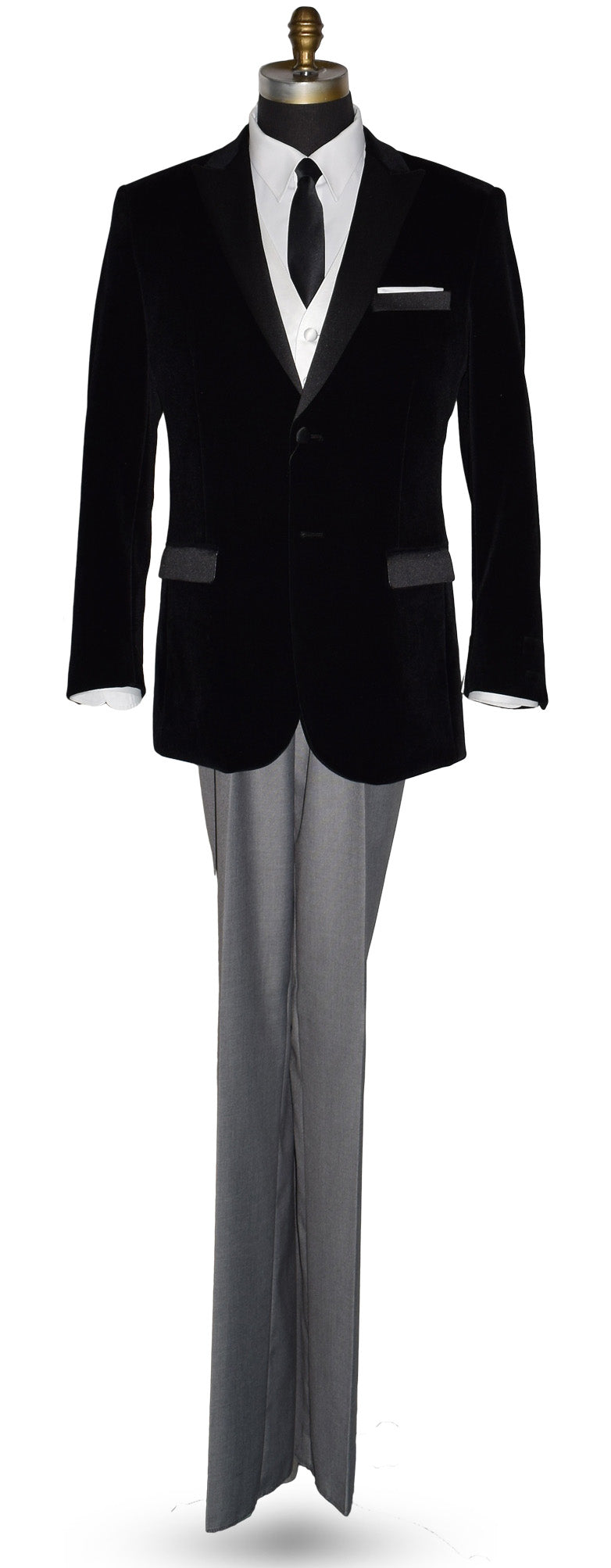 life size mannequin wearing black velvet tuxedo with white shirt and gray pants and a skinny black satin necktie on a mannequin against a white background
