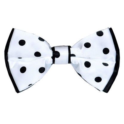 White bow tie with black polka dots on a white background