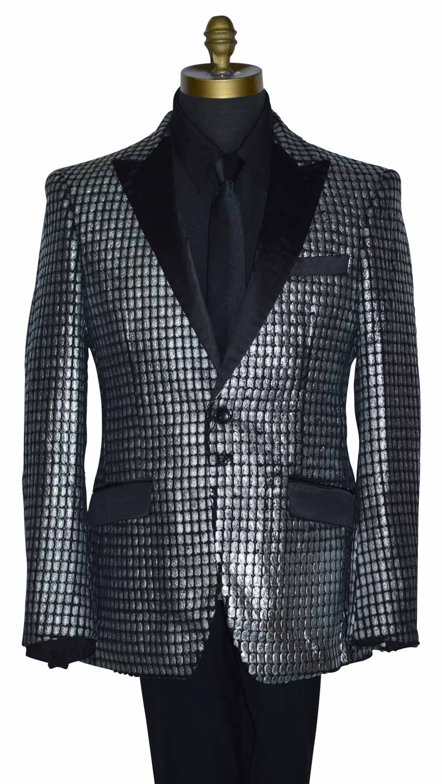 close-up silver and black tuxedo on a mannequin with a black tuxedo shirt and a long black necktie