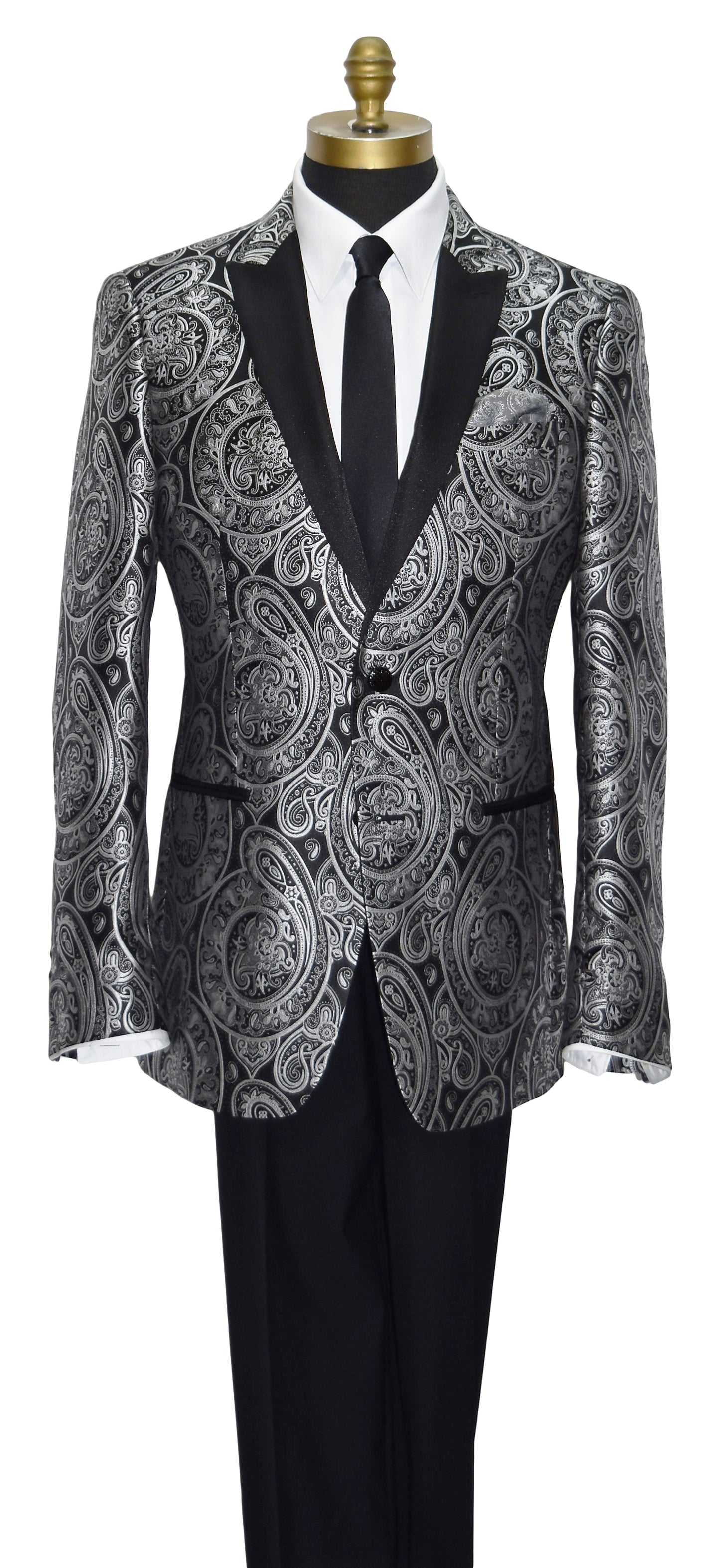 close-up mannequin wearing a black tuxedo with silver paisley with black tuxedo pants and a black satin skinny necktie against a white background
