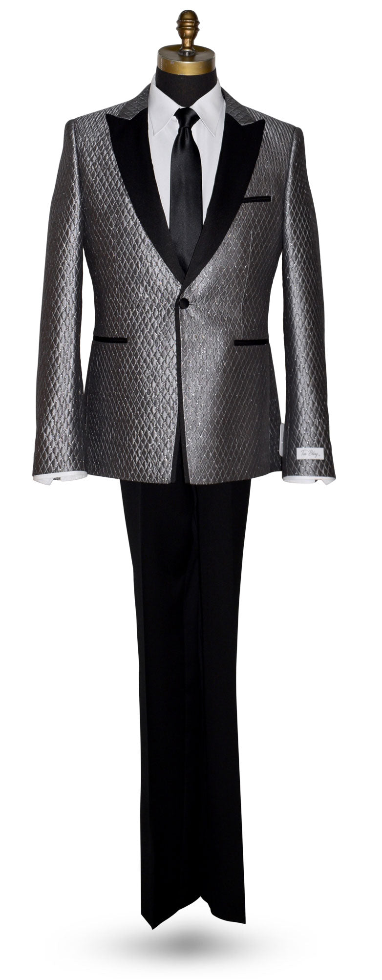Gray patterned suit with black lapels and black satin dress tie on a mannequin against a white background