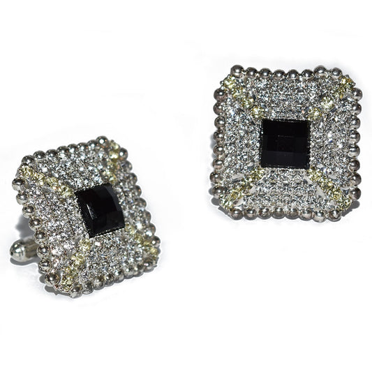 Pair of bling square cufflinks with black center and diamond-like stones on a white background