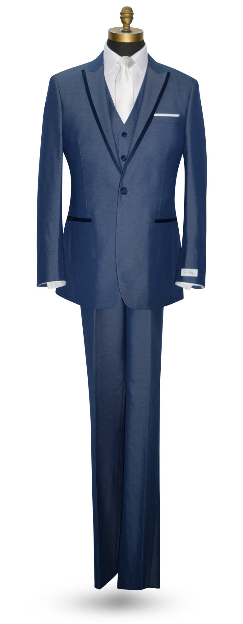 life size mannequin wearing a Blue 3-piece peak lapel tuxedo with a white long necktie against a white background.