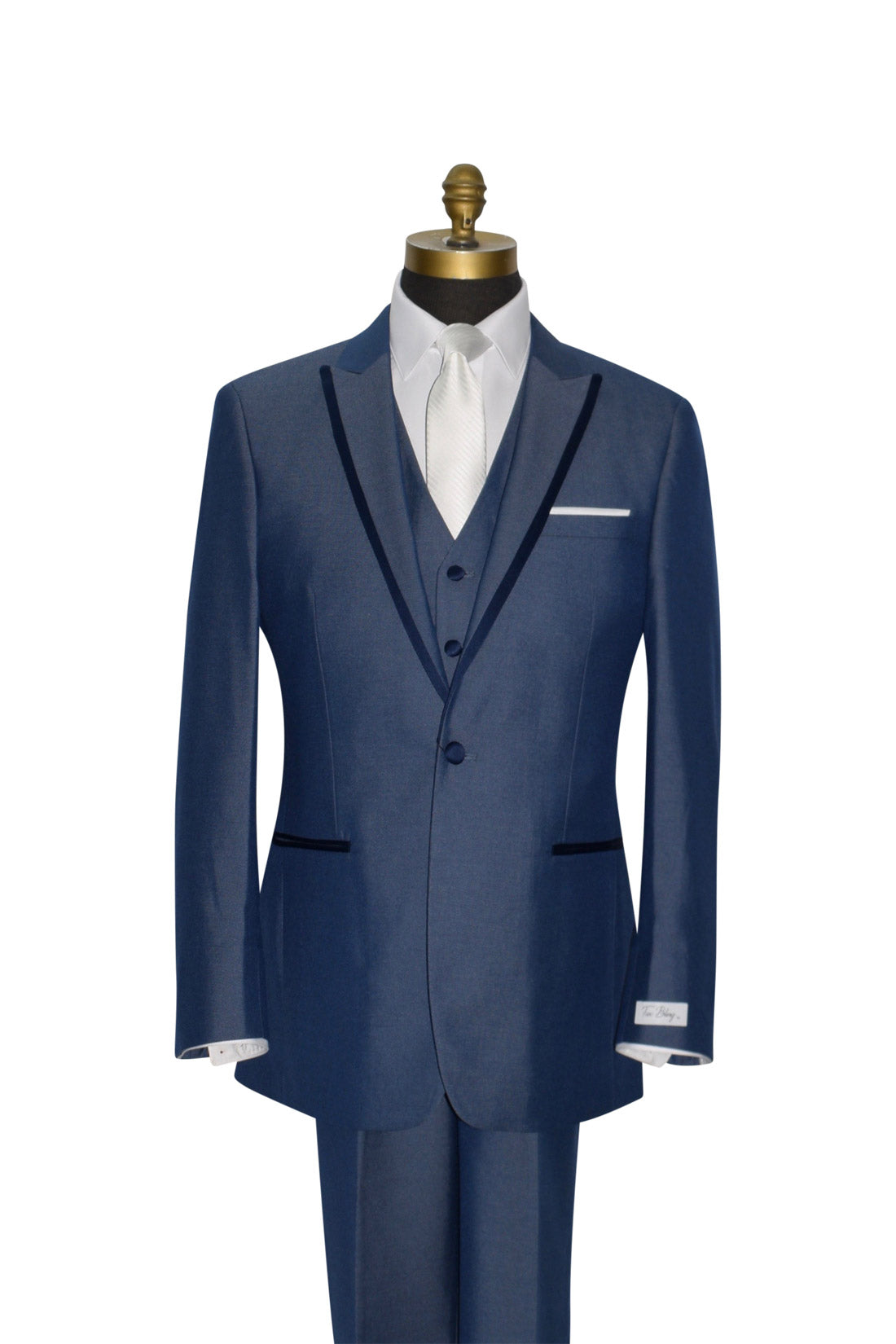 close-up mannequin wearing a Blue 3-piece peak lapel tuxedo with a white long necktie against a white background.