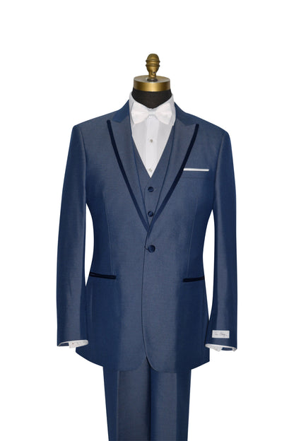 close-up Blue 3 piece peak lapel tuxedo with a white bowtie against a white background.