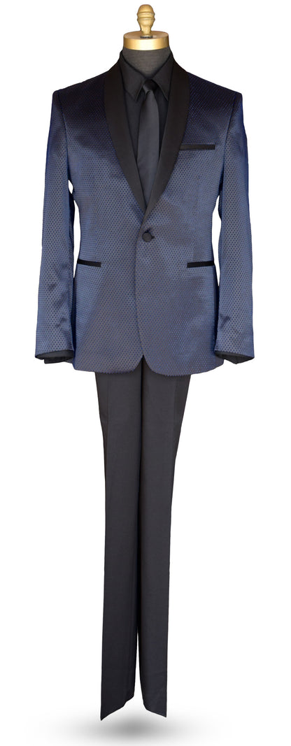 Life size mannequin wearing a blue shawl collar tuxedo with a black tuxedo shirt and long black necktie against a white background