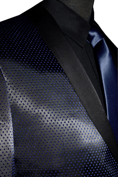 very close-up side view mannequin wearing a blue shawl collar tuxedo with a black tuxedo shirt and long blue necktie against a white background