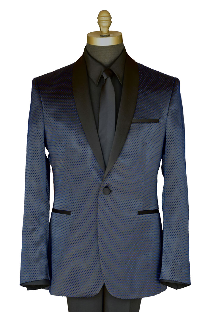 close-up mannequin wearing a blue shawl collar tuxedo with a black tuxedo shirt and long black necktie against a white background