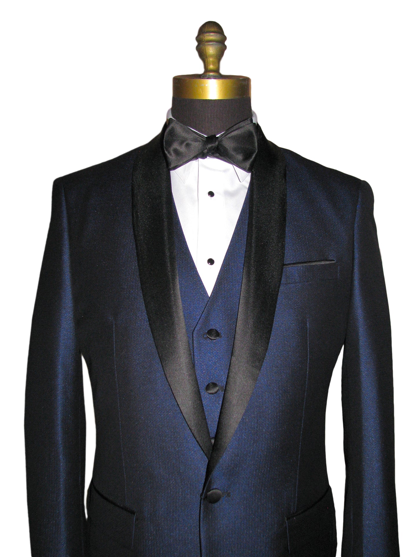 close up of mannequin wearing a blue shawl collar tuxedo with matching blue vest and a black bowtie against a white background