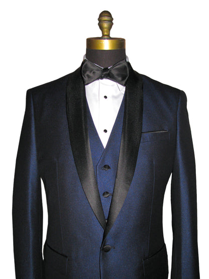 close up of mannequin wearing a blue shawl collar tuxedo with matching blue vest and a black bowtie against a white background