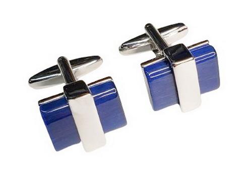 Pair of cufflinks with blue and silver design on a white background