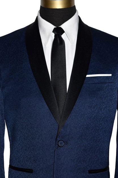 close-up front view-Navy blue tuxedo with black shawl collar with a brocade print on a mannequin with black tuxedo pants and a white tuxedo shirt and skinny black satin necktie in front of a white background