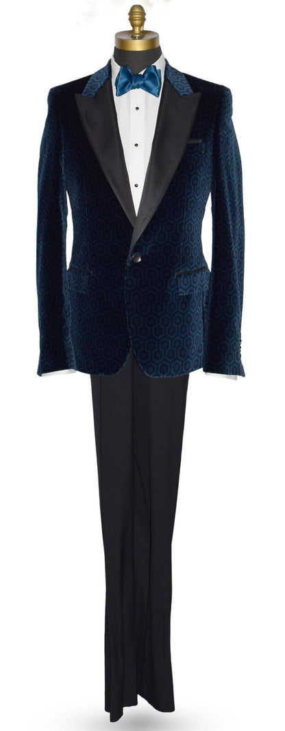 life size mannequin wearing a blue velvet tuxedo jacket with a white tuxedo shirt and blue tie-yourself bowtie against a white bakground