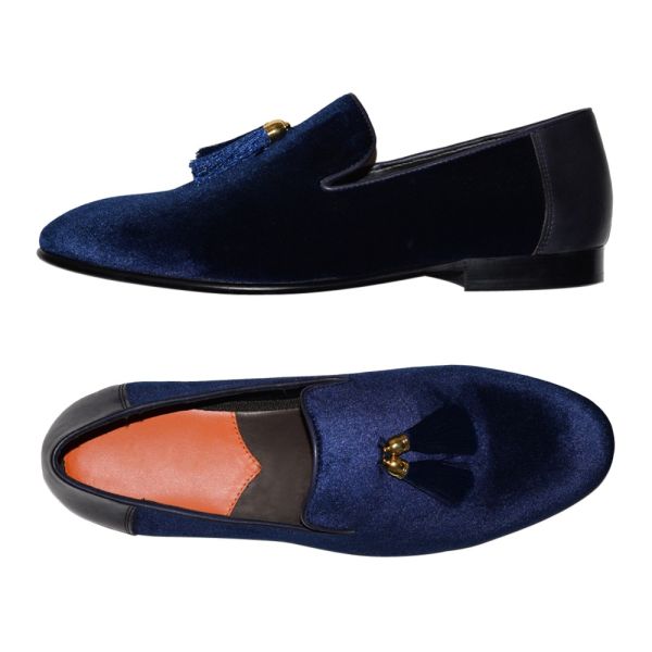 men's blue velvet dress shoes with tassels against a white background