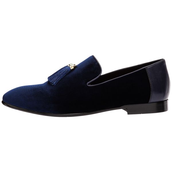 close-up side view men's blue velvet dress shoes with tassels against a white background