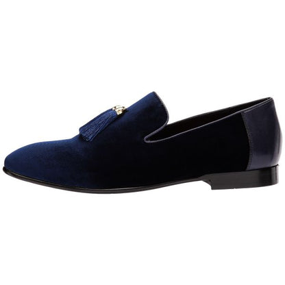 close-up side view men's blue velvet dress shoes with tassels against a white background
