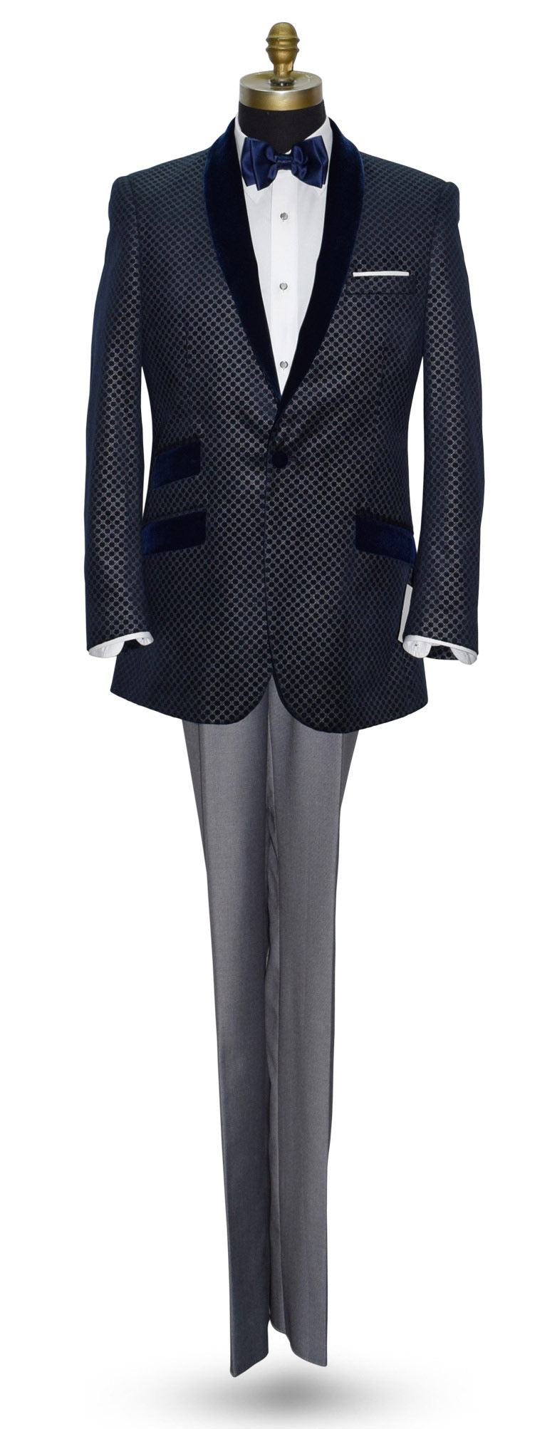 life size mannequin wearing blue velvet dinner jacket with silver pattern with gray pants and blue bowtie