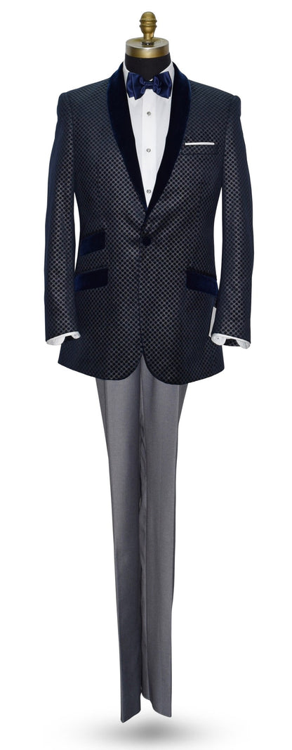 life size mannequin wearing blue velvet dinner jacket with silver pattern with gray pants and blue bowtie