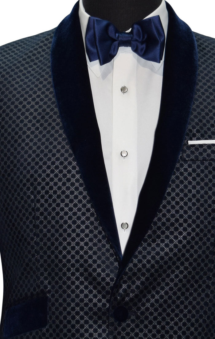 very close-front view blue velvet dinner jacket with silver pattern on a mannequin with a blue bowtie