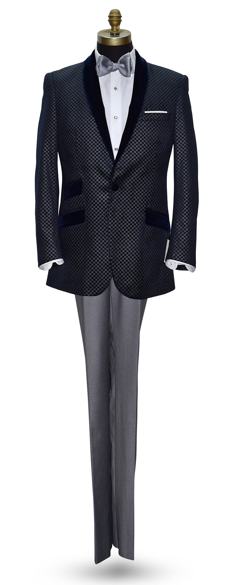 blue velvet dinner jacket with silver pattern on a mannequin with gray pants and gray bowtie