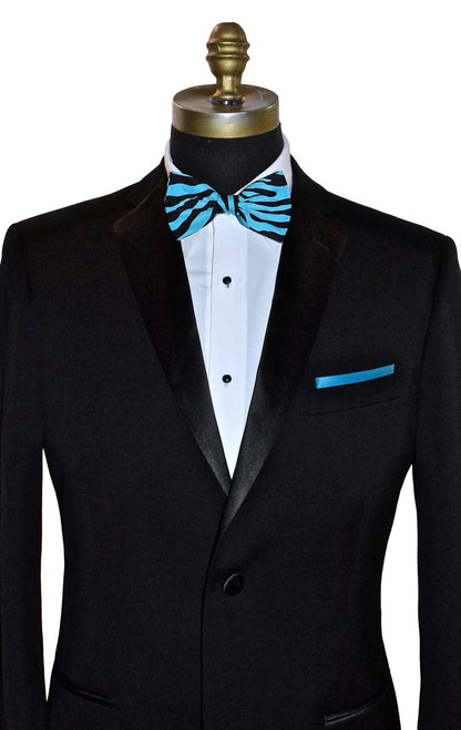 Black tuxedo with a blue and black zebra print bow tie on a mannequin against a white background.