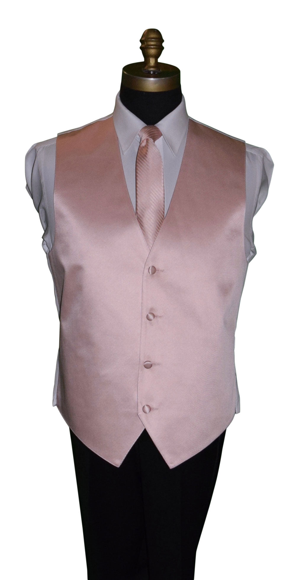 close-up mannequin wearing a white dress shirt with a blush tuxedo vest and a blush striped necktie against a white background