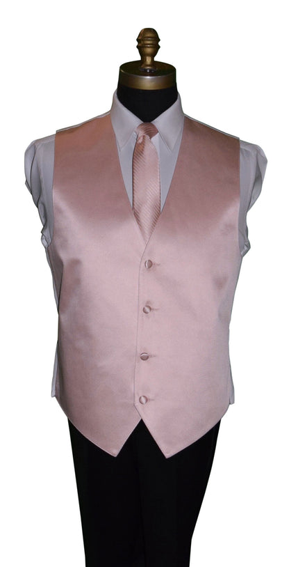 close-up mannequin wearing a white dress shirt with a blush tuxedo vest and a blush striped necktie against a white background