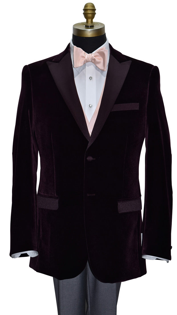 wine velvet dinner jacket wearing a blush "tie-yourself" bowtie and a blush tuxedo vest with gray pants on a mannequin against a white background