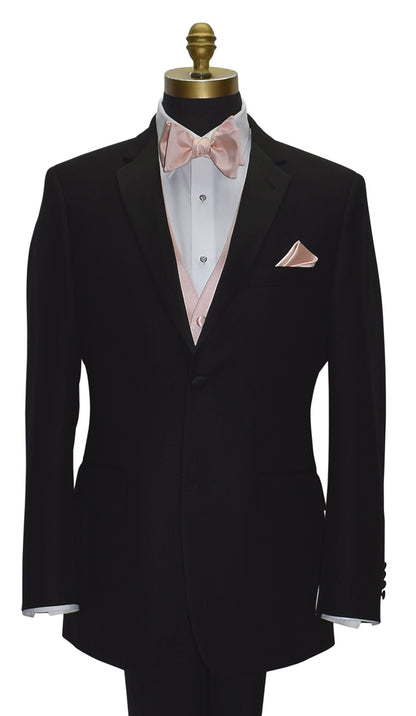 close-up mannequin wearing a black notch-lapel tuxedo with a white dress shirt and a blush tuxedo vest with a blush "tie-yourself" bowtie against a white background