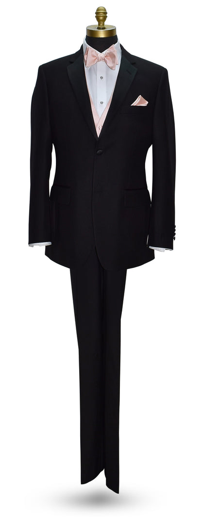 life size mannequin wearing a black notch-lapel tuxedo with a white dress shirt and a blush tuxedo vest with a blush "tie-yourself" bowtie against a white background