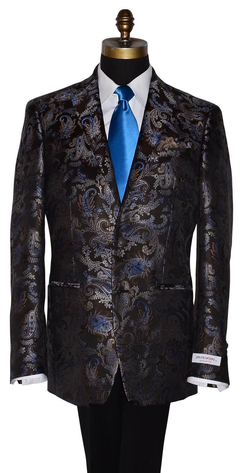 brown and blue paisley patterned dinner jacket with a blue long satin necktie on a mannequin against a white background