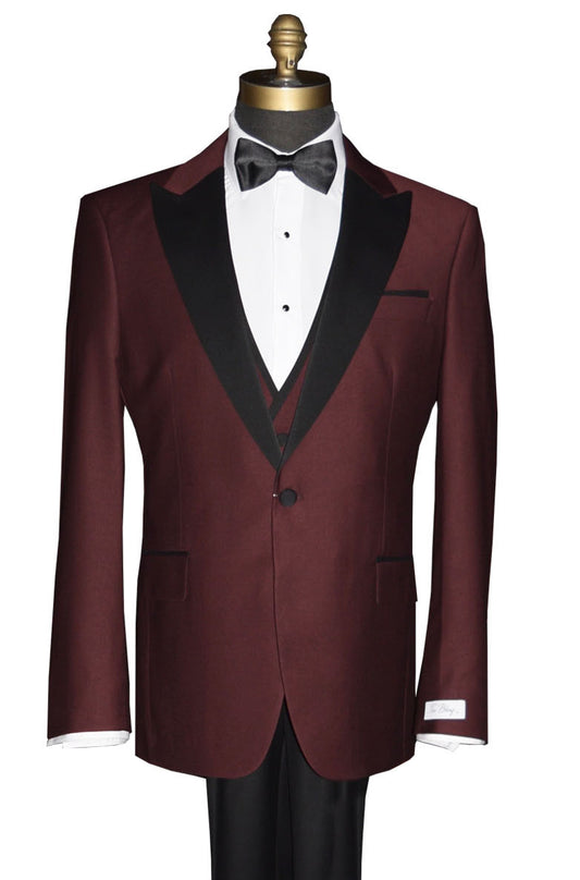close-up burgundy 3 piece tuxedo with black lapels on a mannequin against a white background