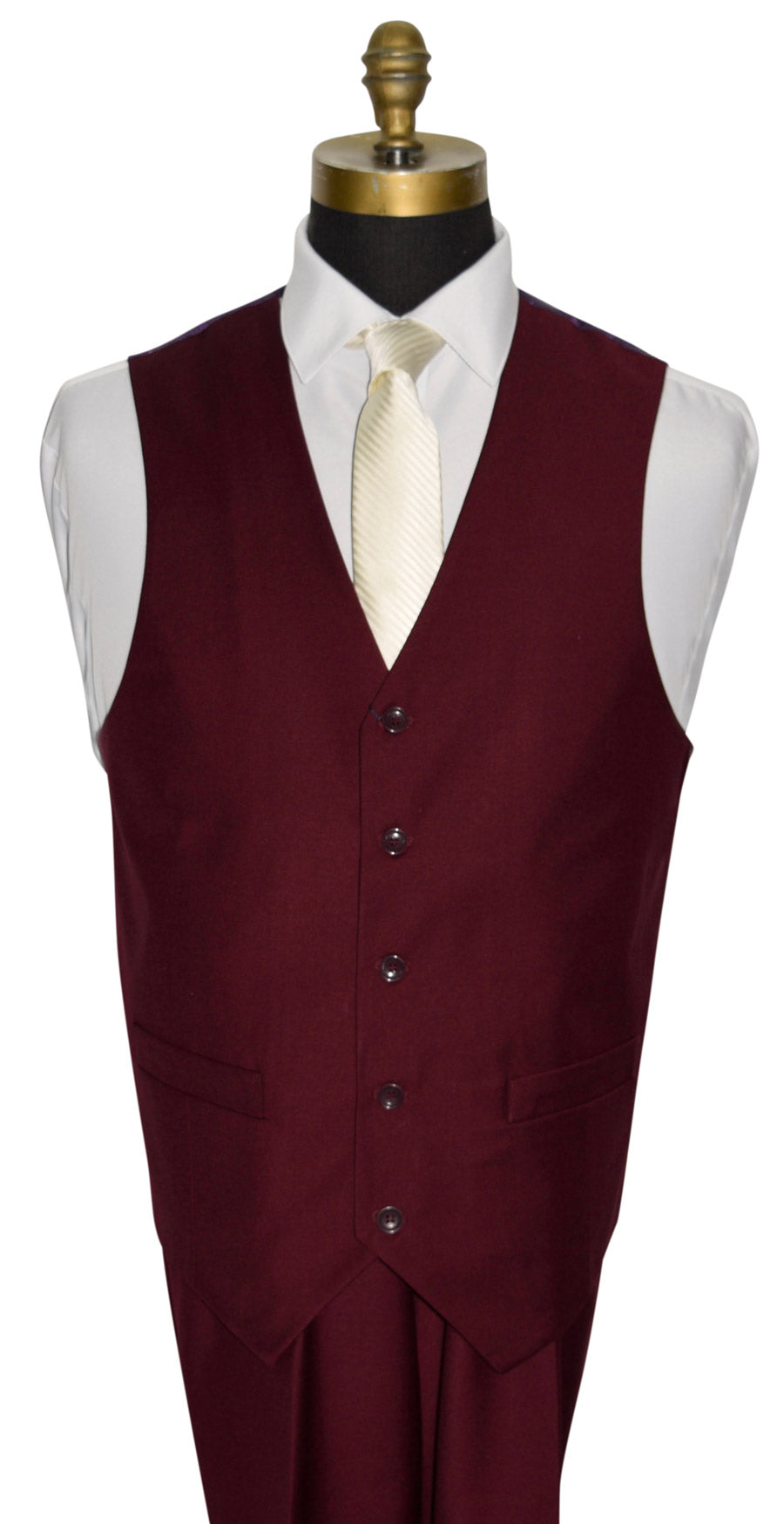 Burgundy vest on a mannequin with a white shirt and ivory necktie.