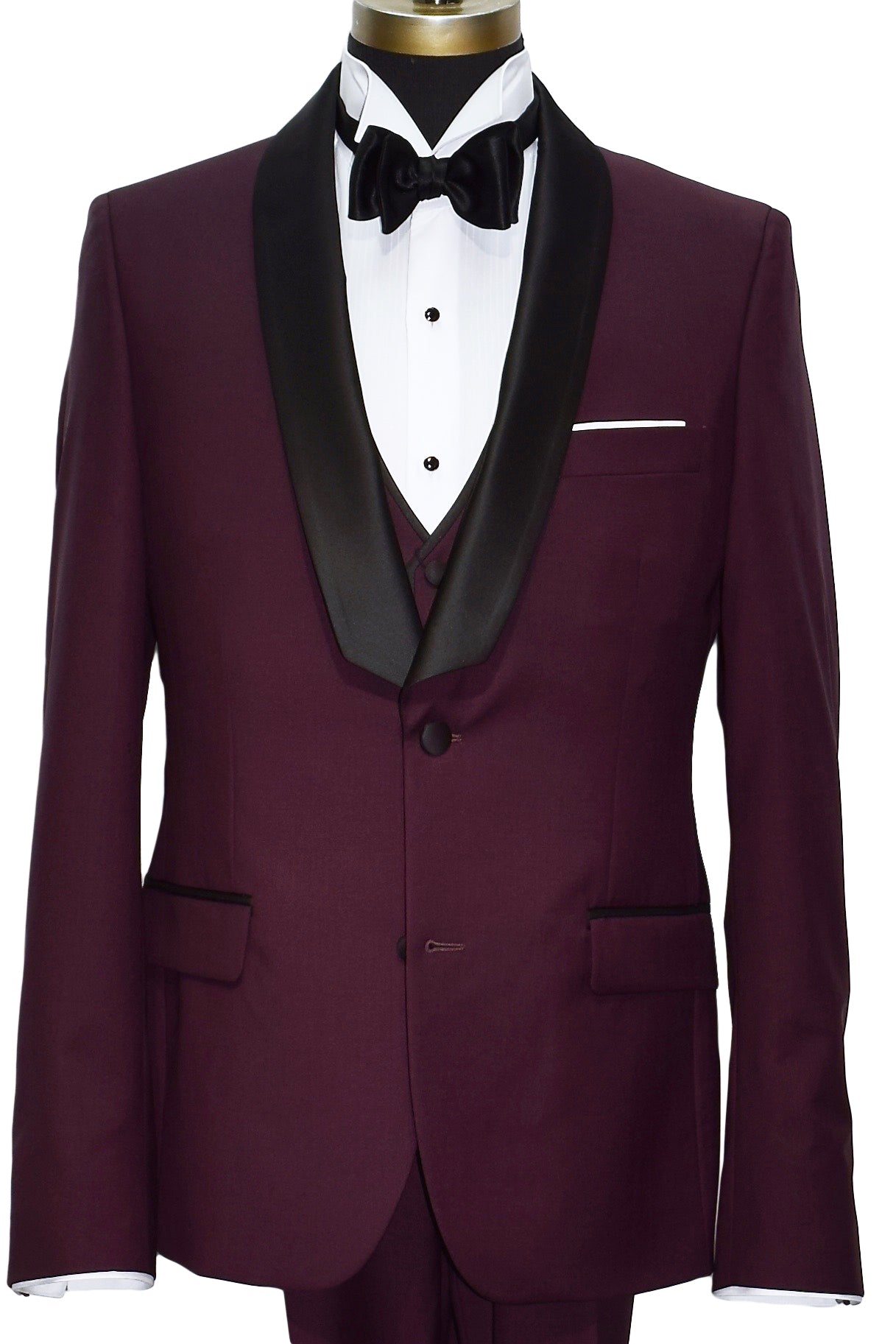Burgundy shawl collar tuxedo with black lapels, a white wing collar tuxedo shirt with a black satin bowtie and the matching burgundy vest with a white pocket handkerchief against a white background