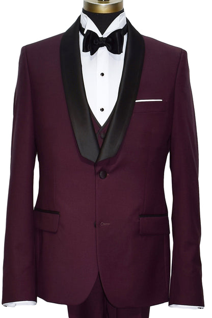 Burgundy shawl collar tuxedo with black lapels, a white wing collar tuxedo shirt with a black satin bowtie and the matching burgundy vest with a white pocket handkerchief against a white background
