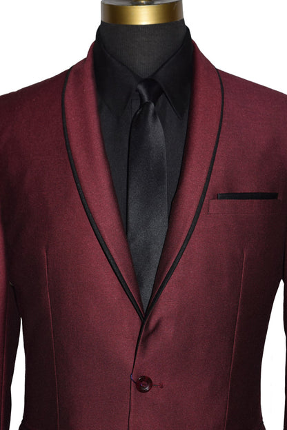 very close up mannequin wearing a burgundy shawl collar tuxedo with a black shirt and black skinny necktie on a mannequin against a white background