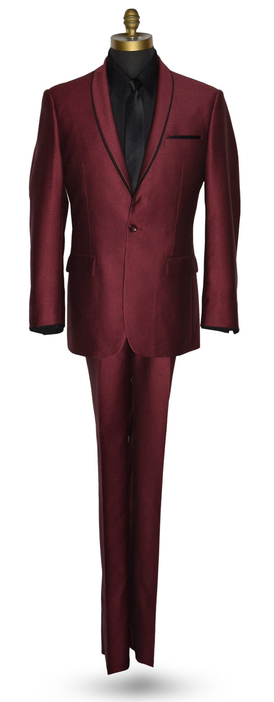 Burgundy shawl collar tuxedo with a black shirt and long black necktie on a mannequin against a white background