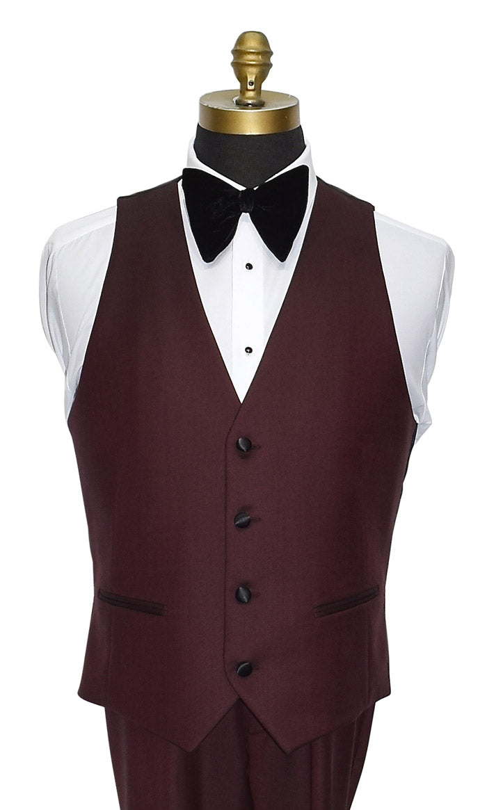 close-up front view of burgundy tuxedo vest and pants set with a large butterfly-bowtie on a mannequin with a white background