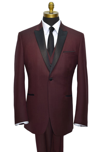 close-up Burgundy tuxedo with black lapels and burgundy vest-wearing a black skinny necktie on a mannequin against a white background