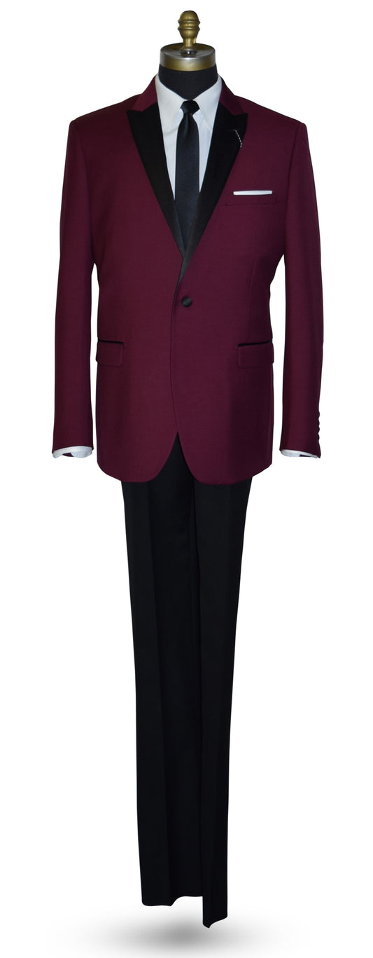 Burgundy tuxedo with black lapels on a mannequin wearing black tuxedo pants and a long black skinny necktie against a white background