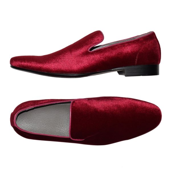 Super nice men's burgundy velvet slip-on shoes against a white background