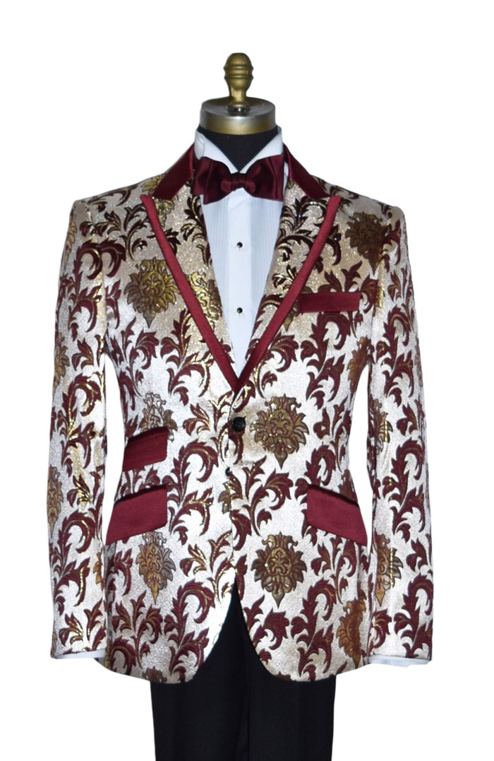 close-up mannequin wearing a champagne colored tuxedo with gold and burgundy floral pattern with a burgundy bowtie against a white background